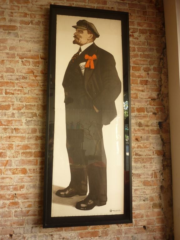 Poster framed sign on the bottom imported publications. Large figure of Vladimir with the Pravda 