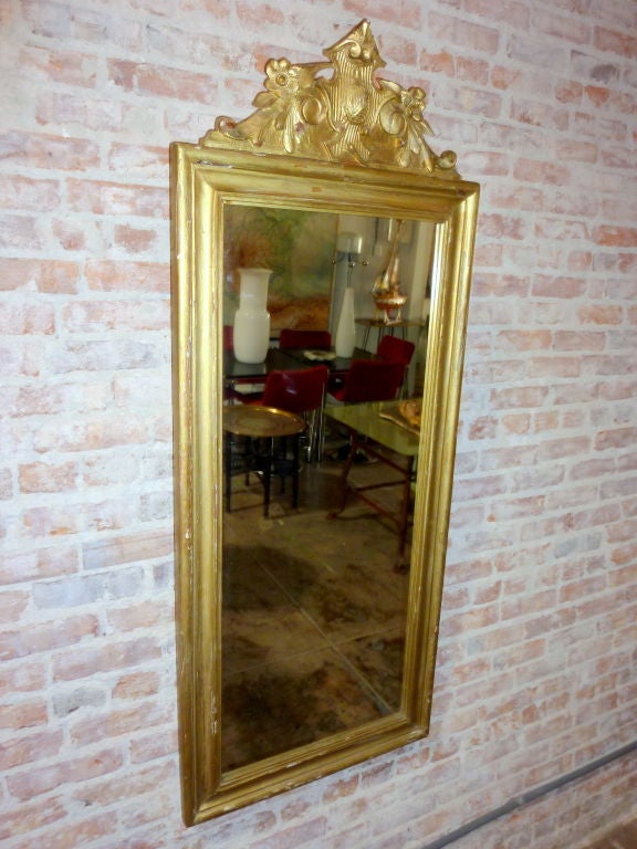 Antique gilded frame mirorr.Frame is walnut wood with the pine backing board .