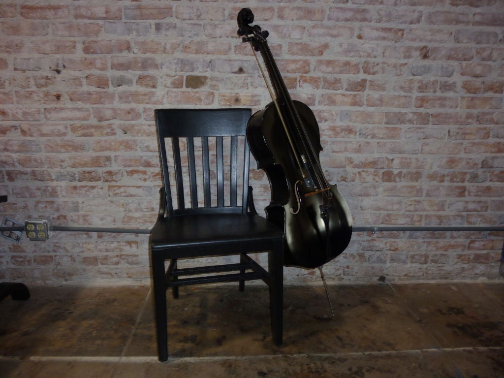 Vienna Music Verkstad ebonized cello .Chair is just to help the exhibition .