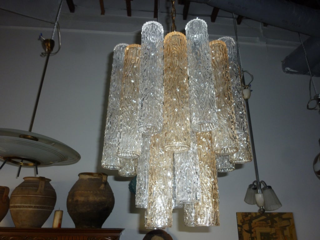 Two-tone glass chandelier on the brass chain, very nice scale. Light fixtures glass dimension 20 inches.