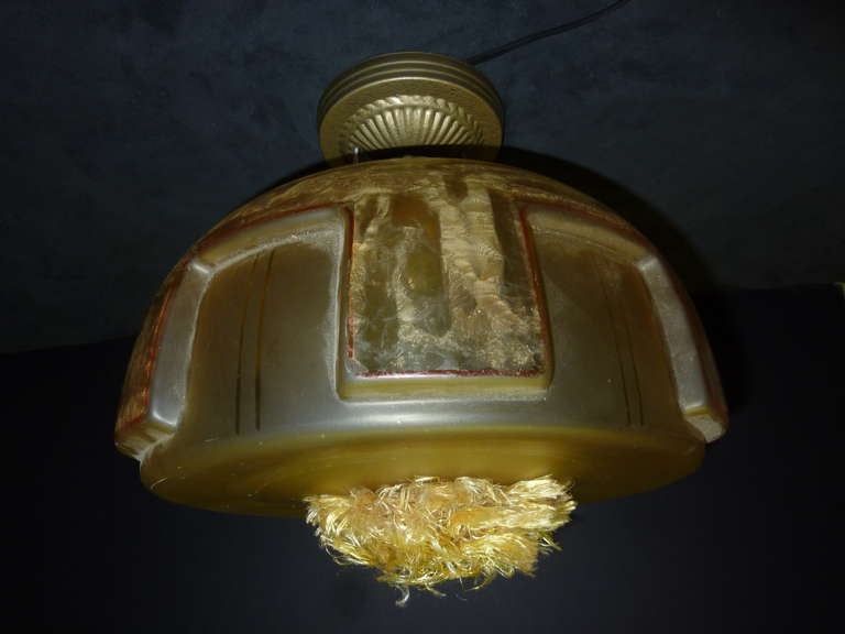 Art Deco ceiling light with the little fife puff in the middle.