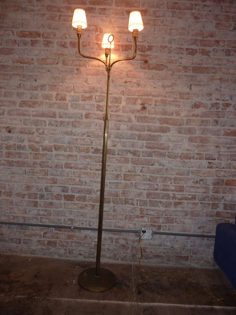 Adjustable height nice patina on the 1930s Italian floor lamp. Can be used with the lampshades or without. Second height is 74 inch. Base is 12 inch. In diameter.