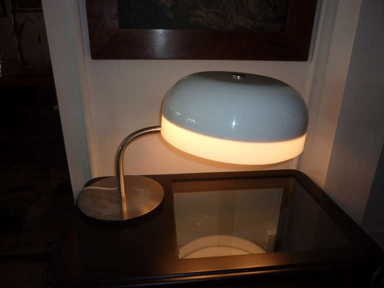         Table  lamp by Ecolight Milano this  company is founded at 1960 s Table lamp is  Design  by Gaetano Sciolari Pivoting shade, extending neck multi position. Professional lamp by Ecolight Milano is produce in 1968.