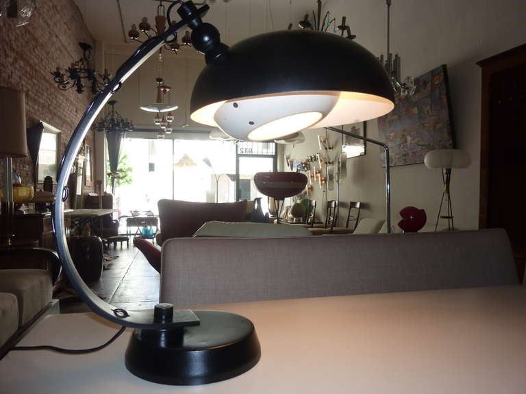 Large table lamp, pivoting neck and adjustable shade.