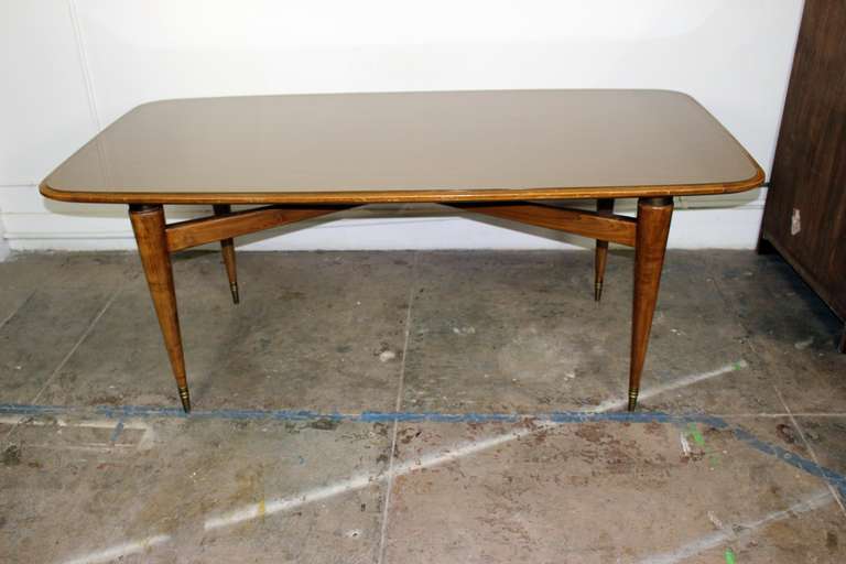 1950s Italian table, brass bouts on the legs, antique pale rose glass color.

Pls note: Item is located at Beverly Store
7274 Beverly Blvd 
Los Angeles, CA 90036
