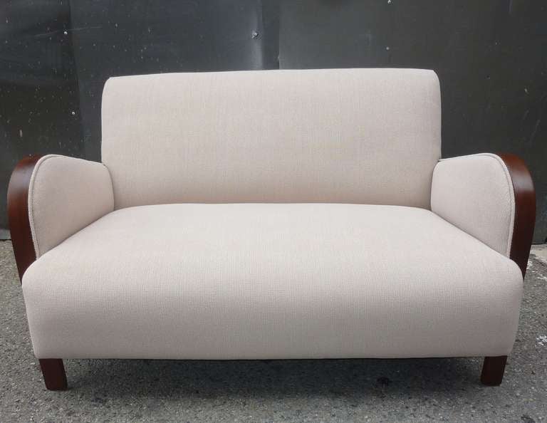 Settee new reupholstered in cotton Italian upholstery material. Dark walnut color wood .Clean line designee ,settee can be implemented in modern or classic antique design.
 

