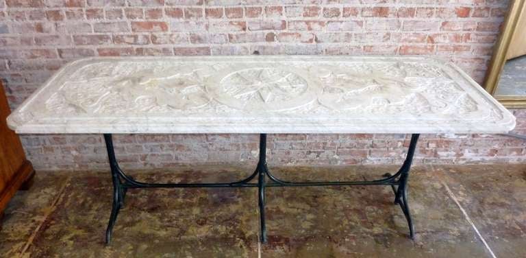 Chiseled marble-top table, iron base.

Pls note: Item is located at Beverly Store
7274 Beverly Blvd 
Los Angeles, CA 90036
