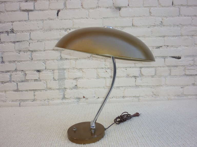 German desk lamp with adjustable neck and shade.