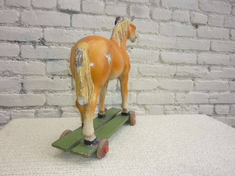 vintage toy horse on wheels