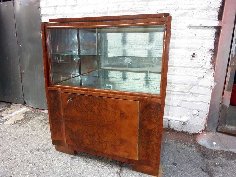 Austrian glass cabinet converted in to the TV cabinet .Walnut base and walnut burl veneer , glass shelf and the mirrors in the back and bottom . Glass sliding doors  relief glass design .