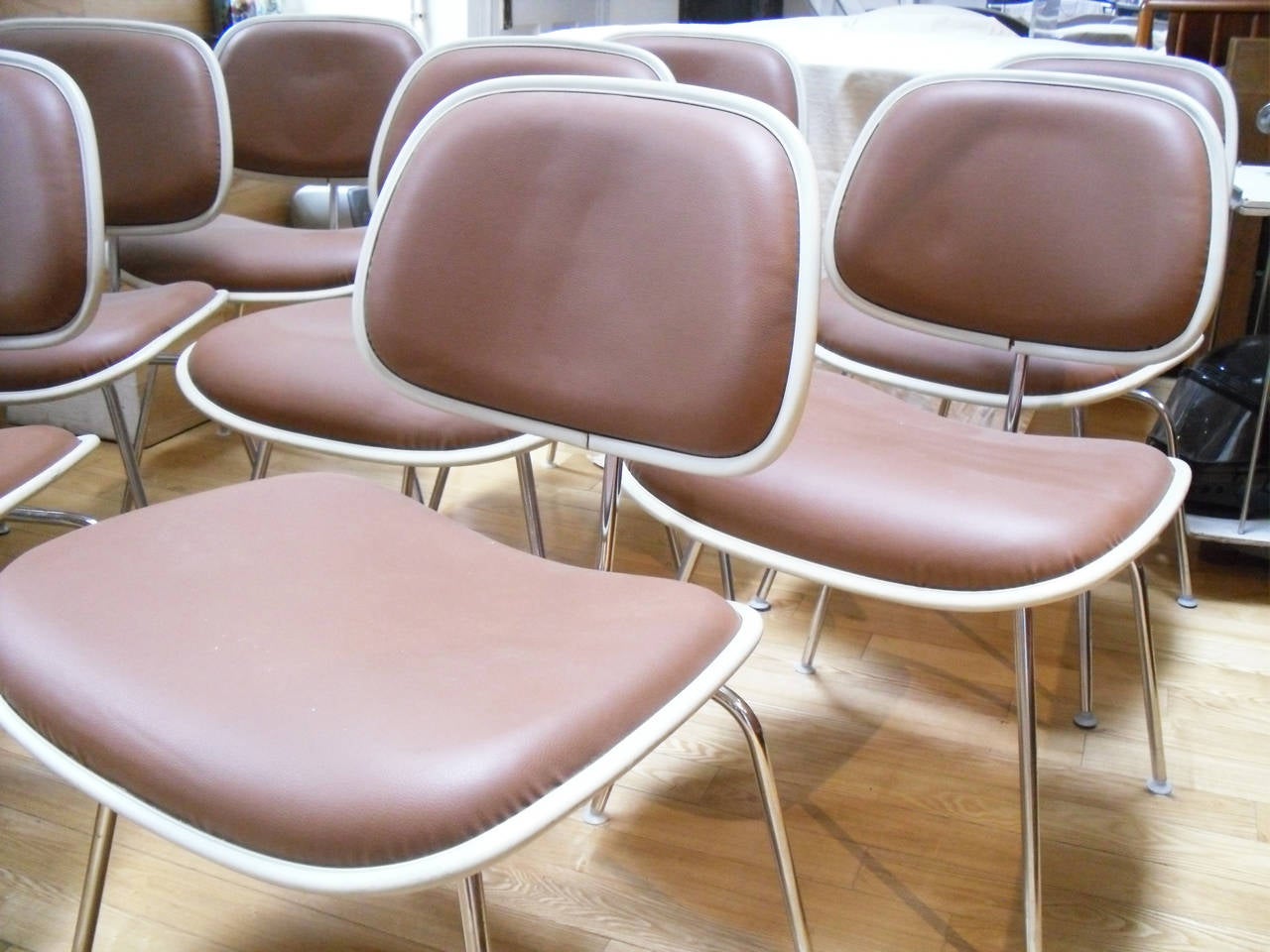 Set of eight Herman Miller DCM Eames dining chairs in leather upholstery.