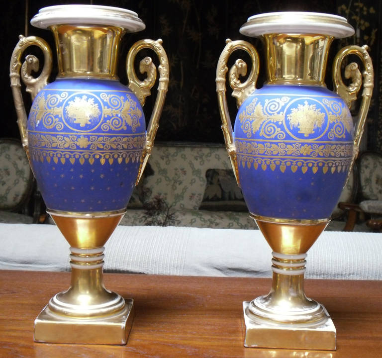 A pair of Paris 19th century porcelain gold and matte-blue ground vases.