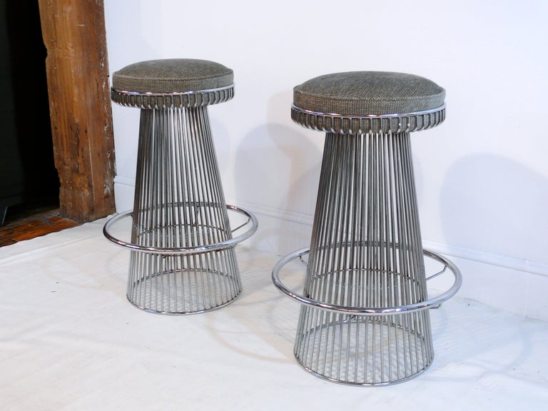 Beautiful pair newly upholstered wire framed chrome bar stools in the manner of Warren Platner.  Generous seat upholstered in chenille.