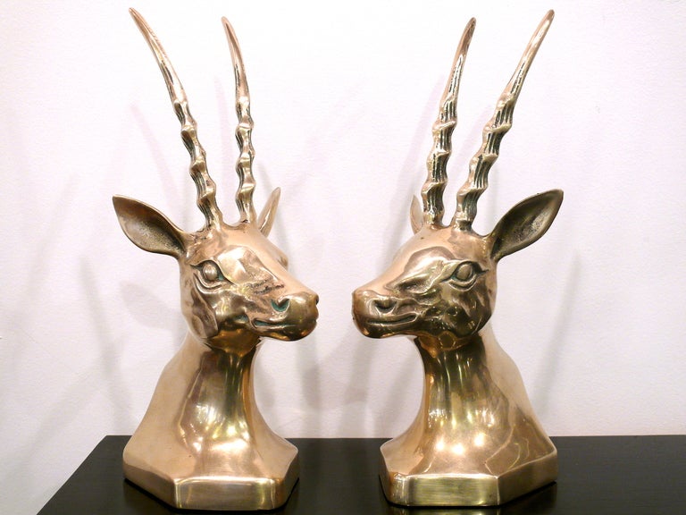 Pair of polished brass antelope head bookends.  Beautiful sculptural form
