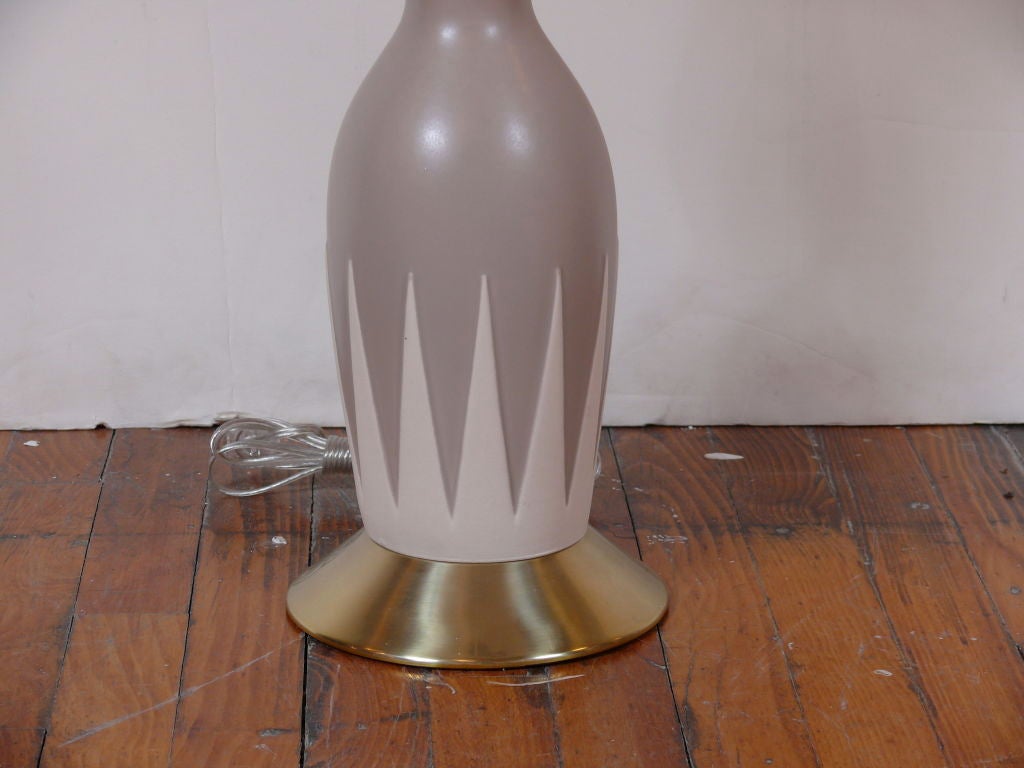 Amazing mid century lamp by Gerald Thurston with brass base and ceramic bodies. Shade not included.