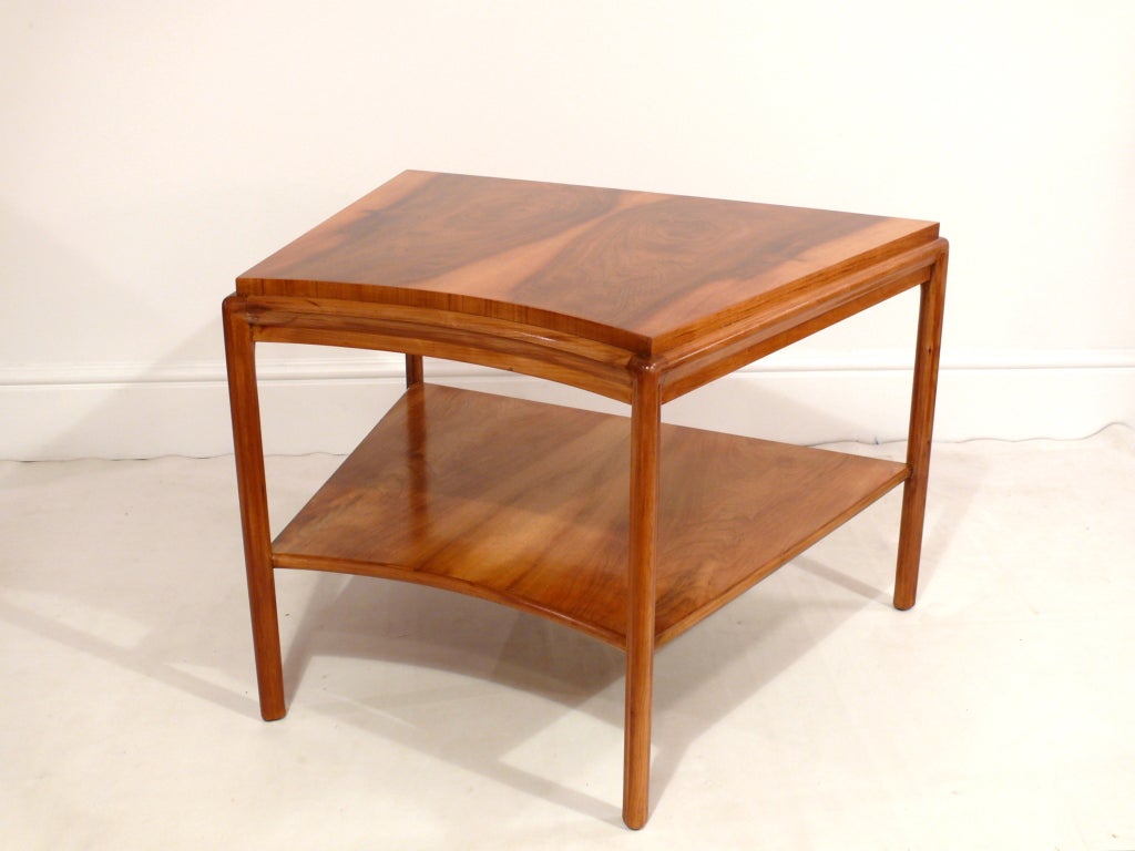 Beautiful 2 tiered side table by John Widdicomb in a natural walnut finish in the manner of Nakashima. Incredible grain to the wood which has been refinished to perfection