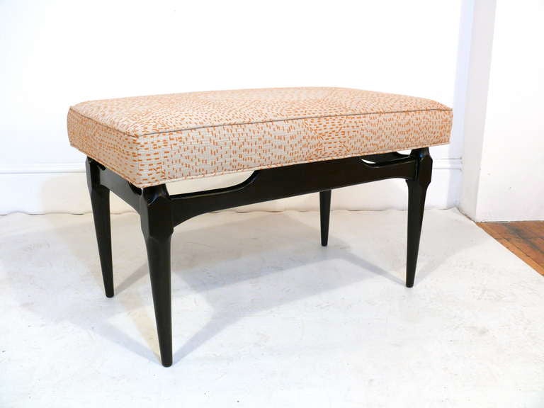Pair of Kagan style benches.  Bases are finished in a deep espresso and tops are covered in a Donghia fabric.