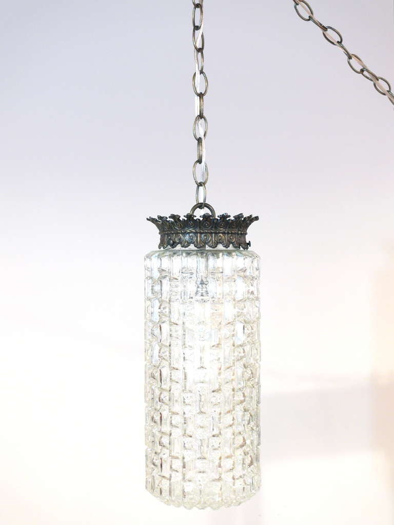 Beautiful pair of prismatic hanging glass pendant lamps. Glass is heavily textured in a contemporary geometric pattern. Newly rewired.