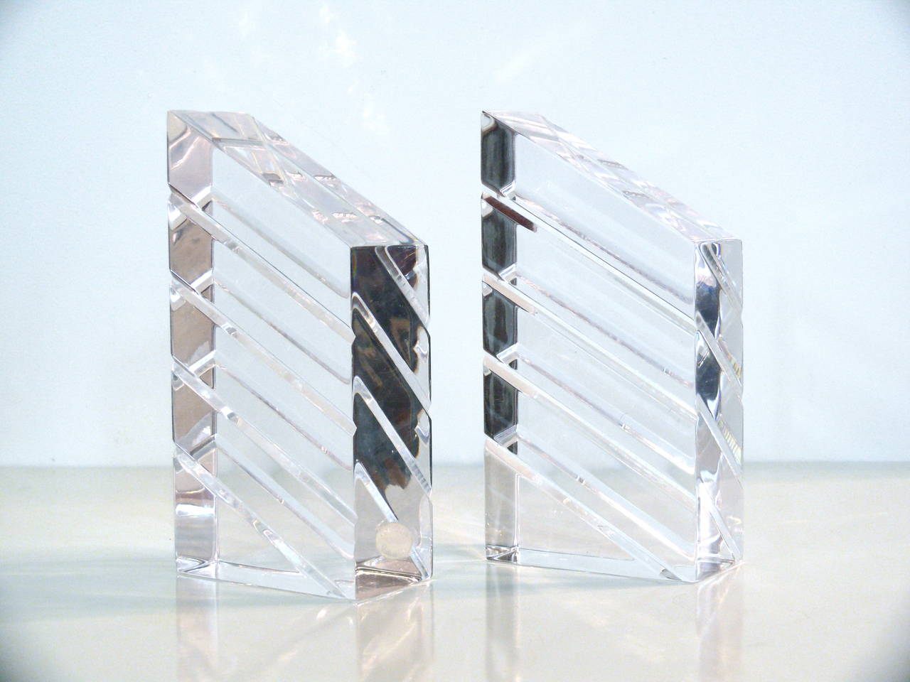Fabulous Pair of Mid Century Modern Acrylic Sculptural Bookends. This pair is in mint condition signed Astrolite. They are beautifully crafted, and versatile for if they are not being used as bookends, they can be displayed as sculptures.