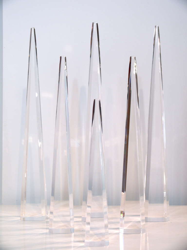 Set of six Lucite Obeslisks in 3 sizes.  3 tall, 2 medium and one small.  Great for a grouping.  Made and labeled Astrolite