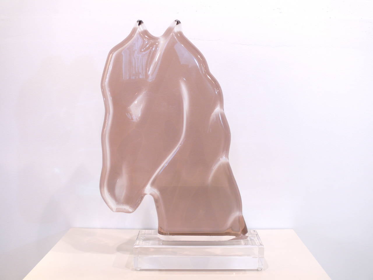 Beautiful smoked lucite horsehead sculpture with rounded edges atop a clear lucite base by Shlomi Haziza, circa 1993.
