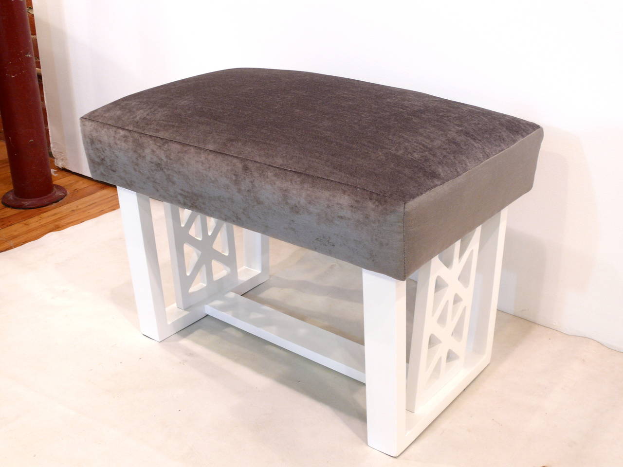 Simple yet great Mid-Century Modern stool lacquered in white. Newly upholstered in a grey velvet.