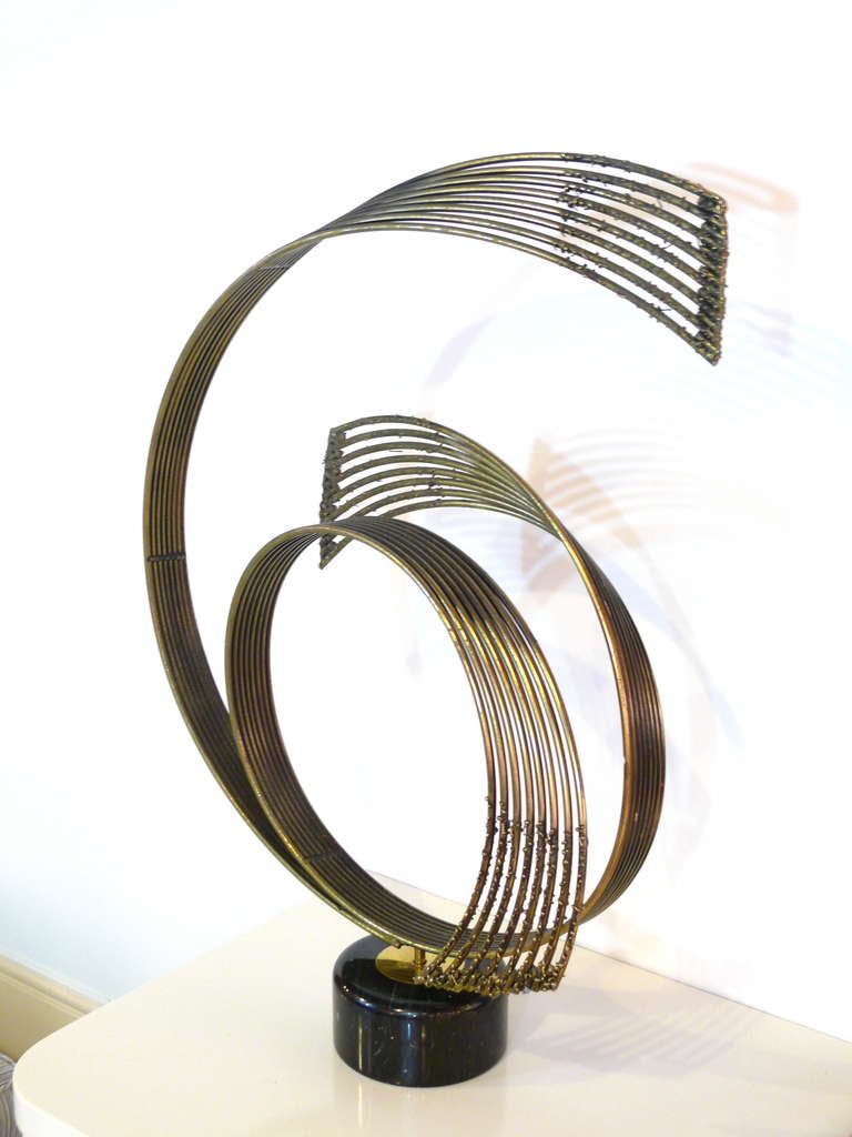Curtis Jere 'windswept' brass sculpture.