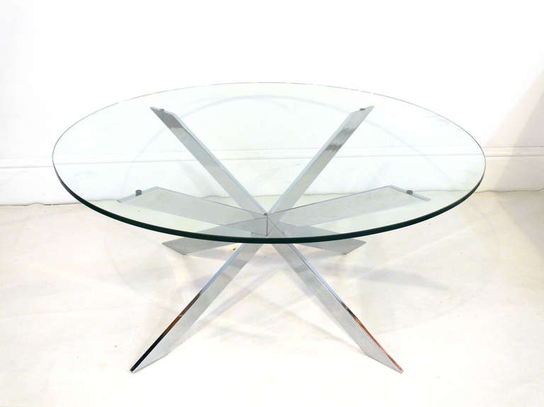 Stunning chrome and glass coffee table by Trimark Design. Chrome base in excellent vintage condition with very minor scratches due to age and use.  Pictured here with a 42