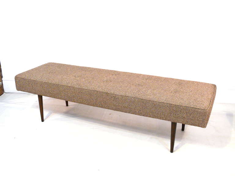 Milo Baughman for Thayer Coggin button tufted bench with walnut legs, signed and dated 1959.  Newly covered in a soft neutral tweed; legs refinished in a medium walnut.