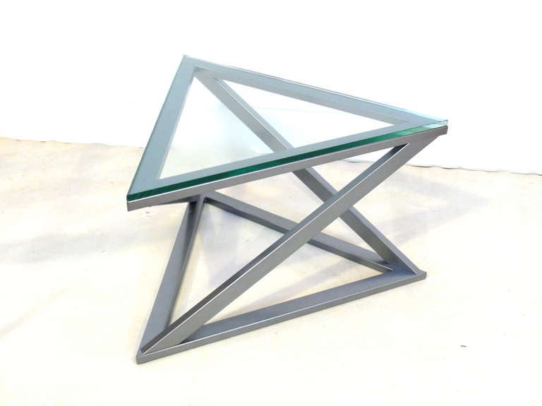 Gunmetal finished triangular table with new glass top.