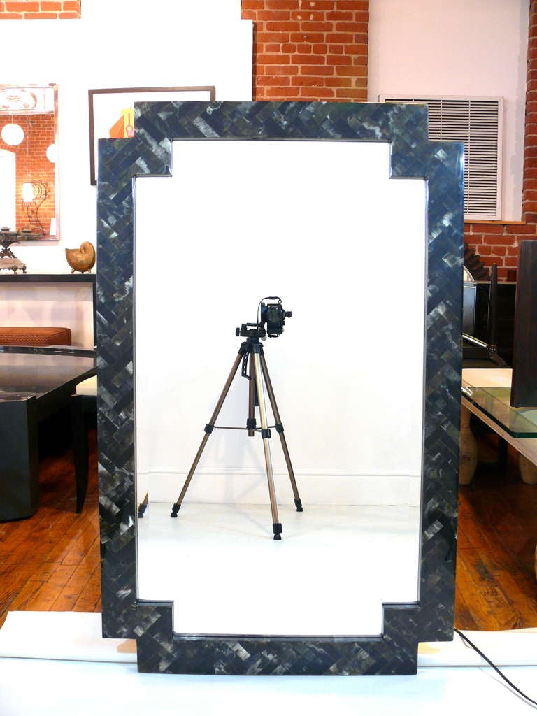 Incredible tasselated stone mirror attributed to Maitland Smith.  Free of chips of breaks, the mirror is also completely beveled.