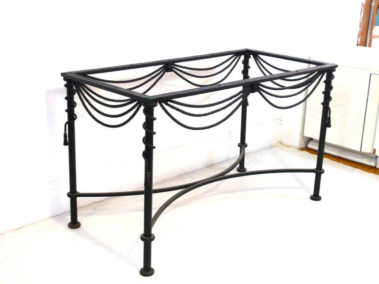 Iron tassel console or dining table base with matte black finish.
Base only. Can take large glass or stone top.