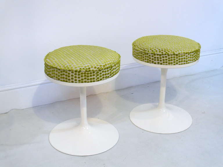 Pair of tulip stools/ottomans in the manner of Knoll.  Newly refinished in white with celadon chenille upholstered tops.  We have a total of four of these stools, if interested let us know.