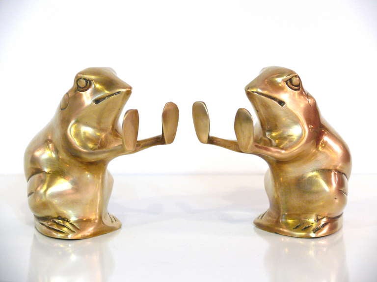 Pair of solid brass mid-Century toad bookends.  Use them as bookends or just as sculptures.  Excellent condition.