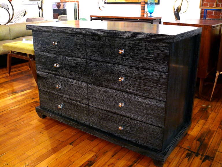 Stunning 4 drawer dresser with nickel hardware in silver cerused mahogany.  The dresser has the appearance of 8 drawers with 8 small pulls. The top and sides are cantilevered and the chest has the appearance of floating.