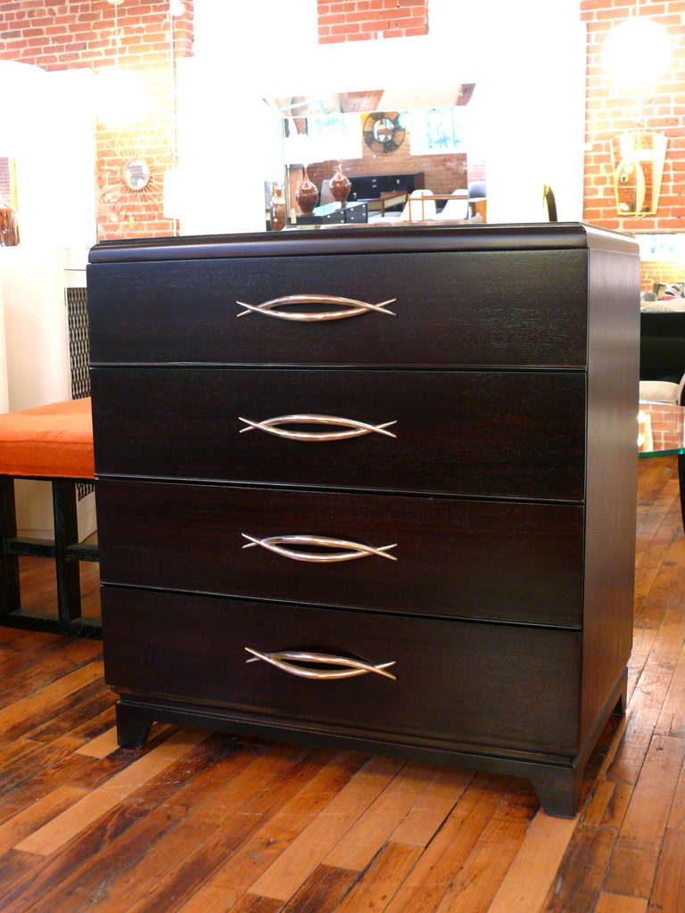 Pair of exquisite four drawer chests with incredible sculptural brass hardware.  Newly refinished in a deep espresso.