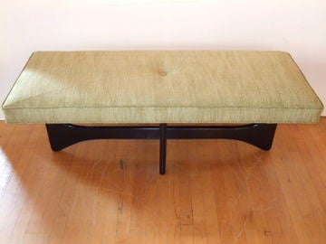 The perfect conversation piece to refresh any style room. Our bench charms with sculptural legs, a plump cushion, and self-welt tailoring. Newly upholstered and refinished with a lacquered finish.