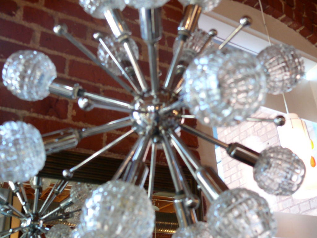 Incredible Italian chrome and cut-glass sputnik chandelier with sixteen heads.