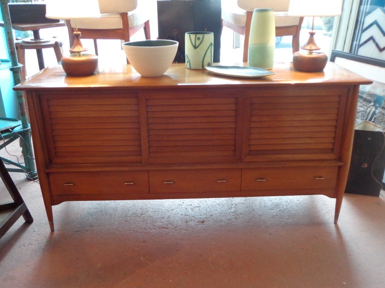 Walnut sideboard by Rway, rare design, three solid wood sliding doors above drawers. excellent original condition, thick curved top.