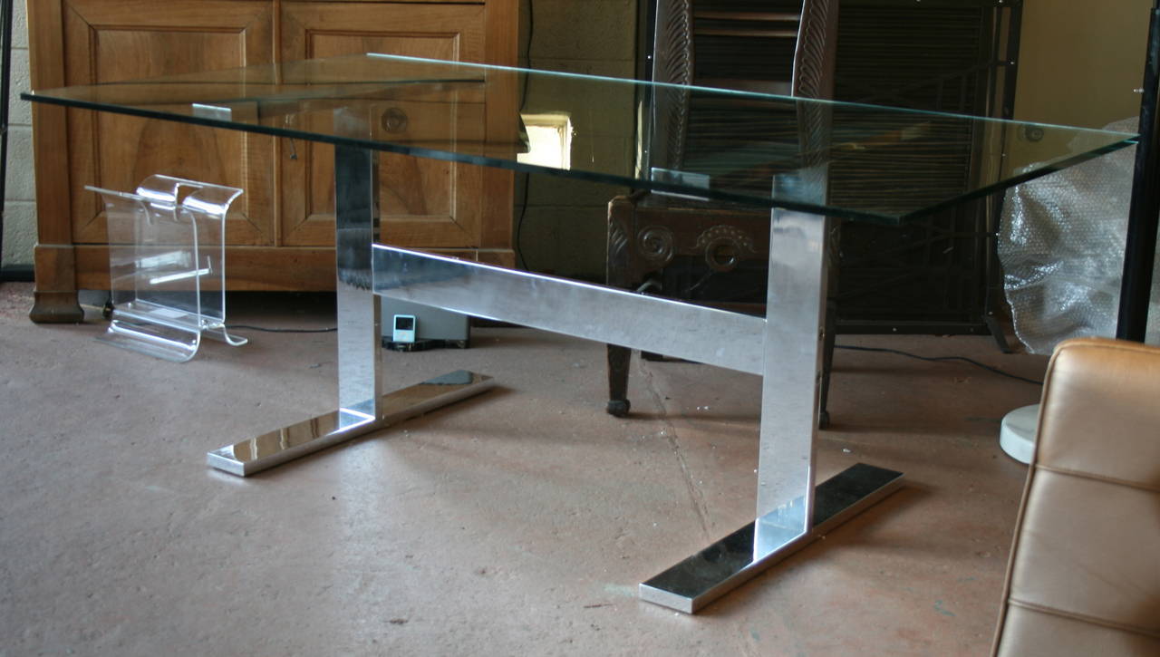 Substantial 1970s polished aluminum trestle dining table or desk. Original glass top has some scratches. Brugola key construction.