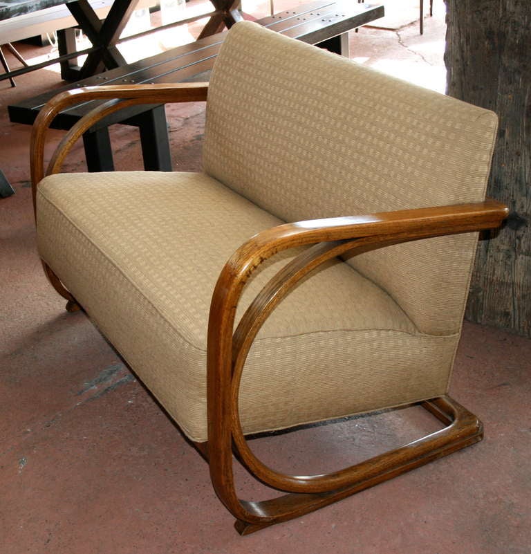 Austrian bentwood settee, impressive cantilevered design. Original maker plate.