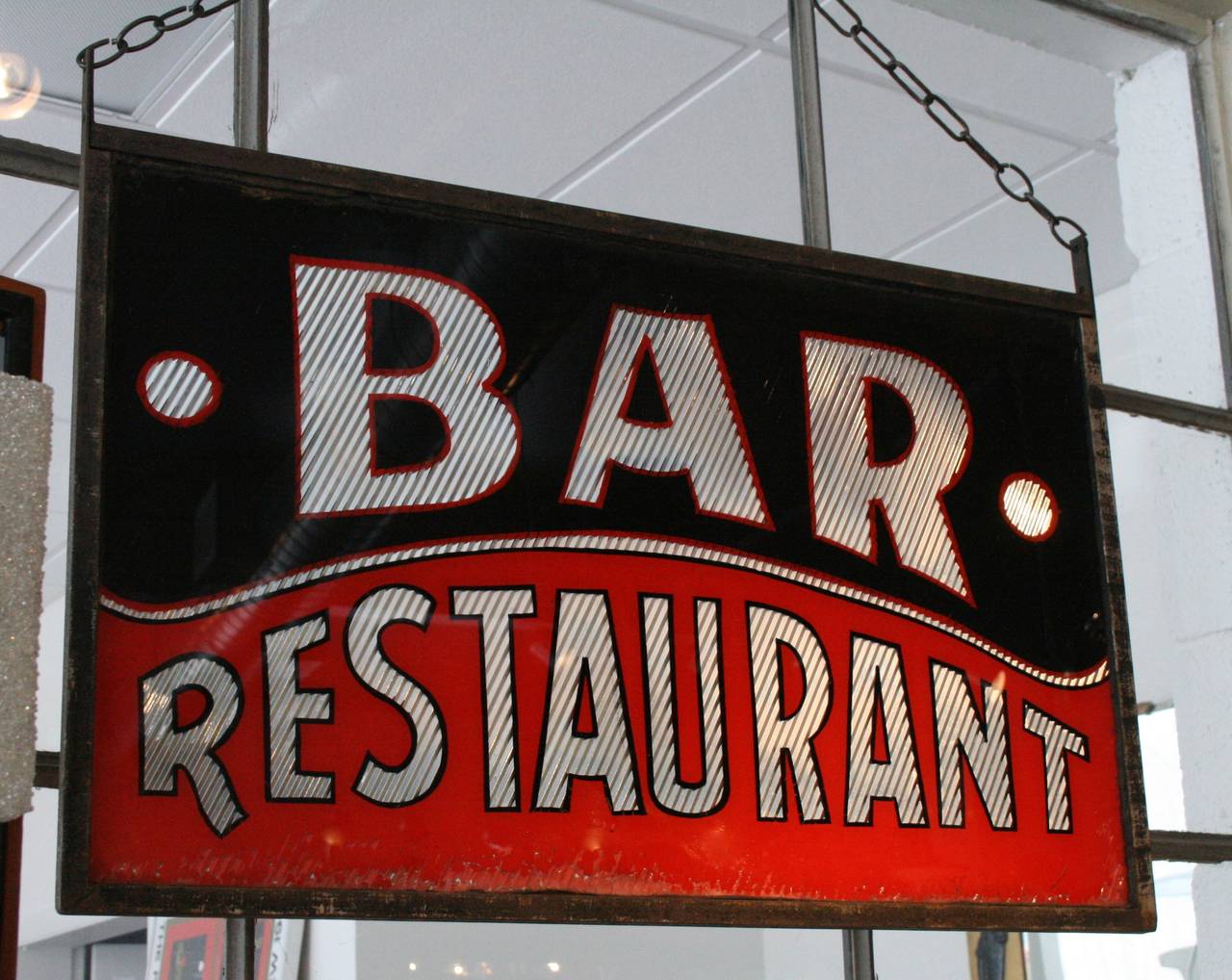 Double-sided sandwiched glass bar restaurant hanging sign in iron frame with chain.