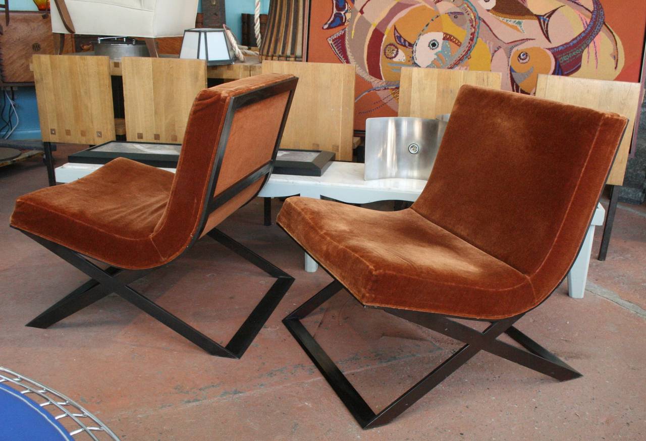Pair of substantial French modern patinated steel X frame lounge chairs in original cinnamon mohair upholstery.