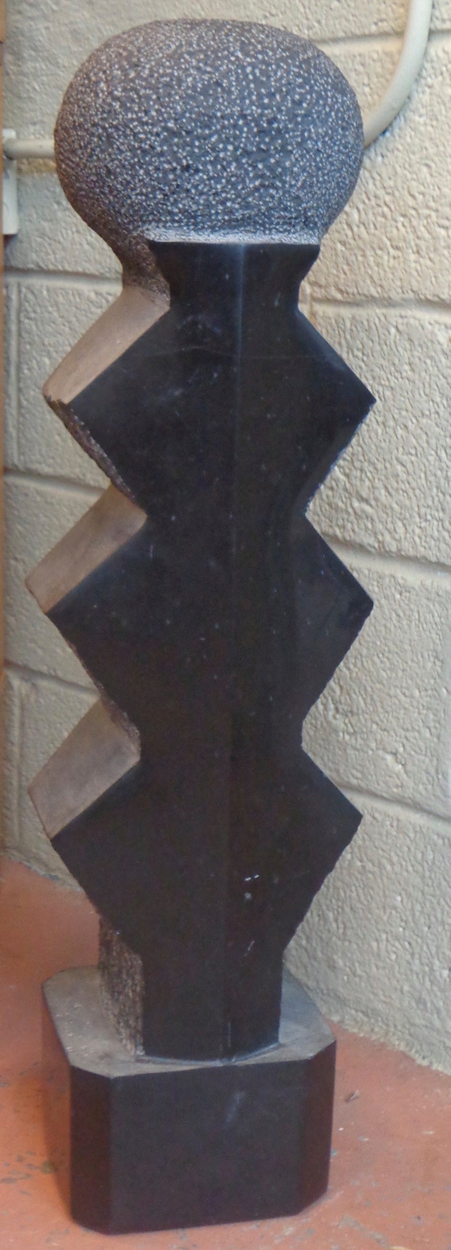 Brancusi inspired chiseled granite sculpture. Signed by artist.