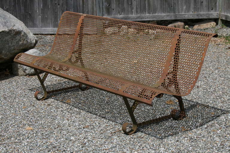 Pair of post-war French pierced metal benches, simple scrolled bases; enjoy the lovely aged paint, rust finish, or repaint in your custom colour.