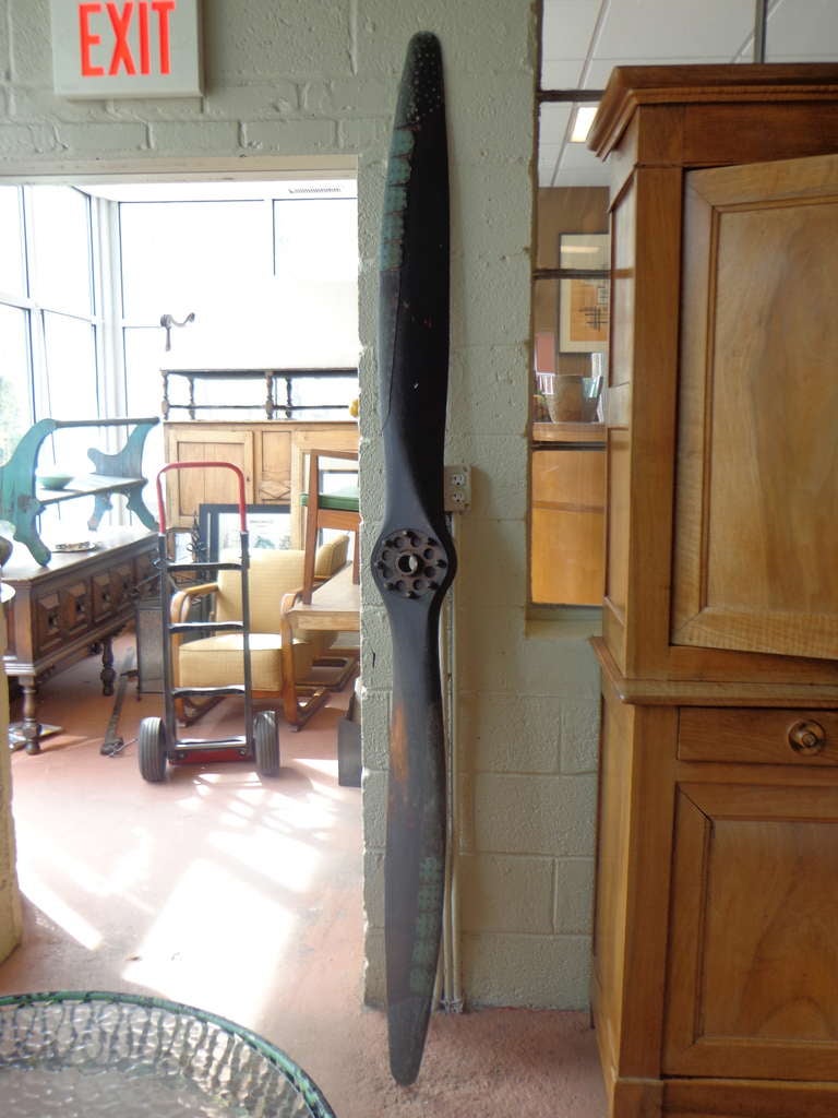 1930's walnut propeller by Hartzell, serial number 12667, design number 409, in untouched original condition, partial original label, riveted copper sheathing also stamped Hartzell.