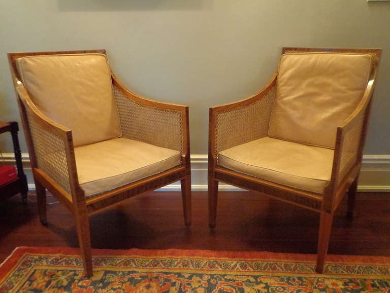 Sublime pair of Kaare Klint mahogany and inlaid Brazilian rosewood chairs, with superb French caning on seats, sides and backs. Buff coloured leather seat cushions.