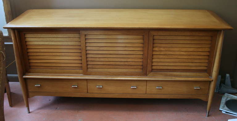 Solid walnut sideboard by Rway, rare design, three solid wood sliding doors above drawers. excellent original condition, thick curved top. Quinessential transitional piece. Perfect for media cabinet.