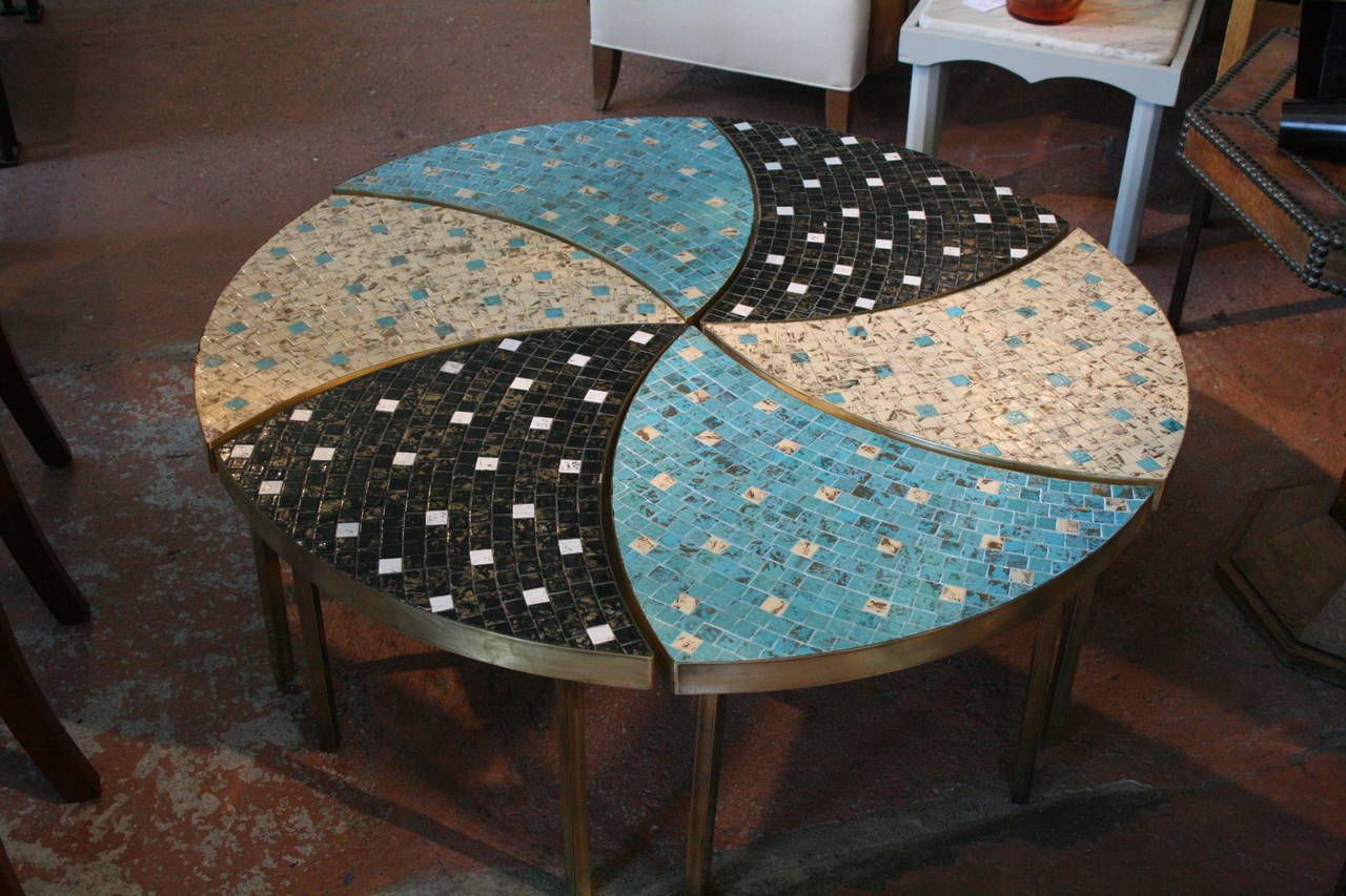 Delightful set of six Italian, 1960s tile tables with brass legs and banding, two in pool blue, two in sand and two black and white, which can be configured as a circular coffee table, or in smaller groupings as side tables or drinks tables.