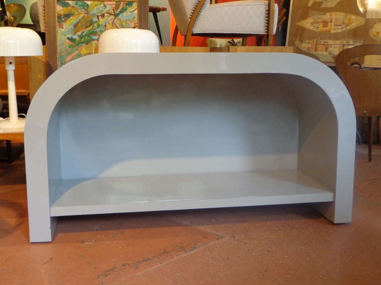 Substantial groovy gray lacquer laminates sideboard or console table with lower shelf.